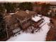 Luxury home with large backyard, snow-covered lawn and tree at 66 Charlou Cir, Cherry Hills Village, CO 80111
