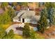 Luxury home with circular driveway and mature landscaping at 66 Charlou Cir, Cherry Hills Village, CO 80111