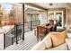 Covered deck with patio furniture, offering a relaxing outdoor space at 66 Charlou Cir, Cherry Hills Village, CO 80111