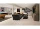 Finished basement with sectional sofa, entertainment center, and pool table at 66 Charlou Cir, Cherry Hills Village, CO 80111