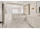 Elegant bathroom with soaking tub and walk-in shower at 66 Charlou Cir, Cherry Hills Village, CO 80111