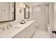 Modern bathroom with double vanity and white subway tile at 66 Charlou Cir, Cherry Hills Village, CO 80111
