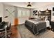 Modern bedroom with a gray upholstered headboard and desk at 66 Charlou Cir, Cherry Hills Village, CO 80111