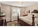 Bedroom with wooden four-poster bed and hardwood floors at 66 Charlou Cir, Cherry Hills Village, CO 80111