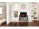 White brick fireplace with ornate screen in the den at 66 Charlou Cir, Cherry Hills Village, CO 80111
