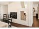 White brick fireplace with gas logs in the dining room at 66 Charlou Cir, Cherry Hills Village, CO 80111