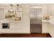 Kitchen features stainless steel refrigerator and ample cabinetry at 66 Charlou Cir, Cherry Hills Village, CO 80111