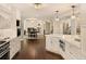 Open concept kitchen with island and views into dining and living areas at 66 Charlou Cir, Cherry Hills Village, CO 80111