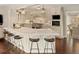 Modern kitchen with white cabinets, a large island, and stainless steel appliances at 66 Charlou Cir, Cherry Hills Village, CO 80111