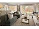 Bright living room with large windows and comfortable seating at 66 Charlou Cir, Cherry Hills Village, CO 80111
