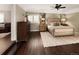 Spacious main bedroom with hardwood floors and large dresser at 66 Charlou Cir, Cherry Hills Village, CO 80111