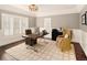 Home office with built-in cabinetry and hardwood floors at 66 Charlou Cir, Cherry Hills Village, CO 80111