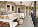 Relaxing patio with sectional seating and metal coffee table at 66 Charlou Cir, Cherry Hills Village, CO 80111