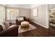 Relaxing sitting area with leather chairs and ottoman at 66 Charlou Cir, Cherry Hills Village, CO 80111