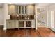 Well-appointed wet bar with wine cooler and ample storage at 66 Charlou Cir, Cherry Hills Village, CO 80111