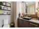 Powder room featuring modern fixtures, a dark vanity, and great lighting at 3219 Castle Butte Dr, Castle Rock, CO 80109