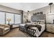 Comfortable bedroom with upholstered bed frame, window blinds, and modern decor at 3219 Castle Butte Dr, Castle Rock, CO 80109