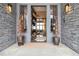 Stunning front entrance with stone accents and an open view to the living room at 3219 Castle Butte Dr, Castle Rock, CO 80109
