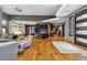 Expansive living room showcasing open layout, hardwood floors, and stylish decor throughout the home at 3219 Castle Butte Dr, Castle Rock, CO 80109