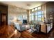 Spacious living room featuring a stone accent wall, fireplace, and large windows with scenic views at 3219 Castle Butte Dr, Castle Rock, CO 80109