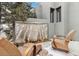 Inviting outdoor space with lounge chairs and decorative fire feature at 3219 Castle Butte Dr, Castle Rock, CO 80109