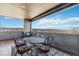 Outdoor seating area with views of distant mountains under a cloudy sky at 3219 Castle Butte Dr, Castle Rock, CO 80109