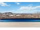 Exterior shot of pool, deck, and mountain views at 3219 Castle Butte Dr, Castle Rock, CO 80109