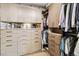 Large walk in closet featuring built in organizers and drawers at 3219 Castle Butte Dr, Castle Rock, CO 80109
