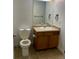 Functional bathroom with a single sink vanity, neutral color scheme, and standard fixtures at 4580 W Alameda Ave, Denver, CO 80219