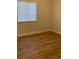 Bedroom with window and wood-look flooring at 4580 W Alameda Ave, Denver, CO 80219