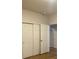 Bedroom with white closet doors and wood-look flooring at 4580 W Alameda Ave, Denver, CO 80219