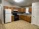 Well-lit kitchen featuring modern appliances, ample cabinet space, and a functional layout at 4580 W Alameda Ave, Denver, CO 80219
