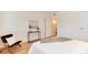 Bedroom with hardwood floors, contemporary furniture, and neutral color palette at 8335 Fairmount Dr # 7-208, Denver, CO 80247