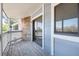 Charming deck with blue siding, stone accents, and a sliding glass door at 8335 Fairmount Dr # 7-208, Denver, CO 80247