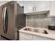 Close-up of a kitchen area featuring stainless steel appliances and modern finishes at 8335 Fairmount Dr # 7-208, Denver, CO 80247