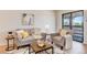 Cozy living room with comfortable seating and sliding door access to the patio at 8335 Fairmount Dr # 7-208, Denver, CO 80247