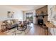 Cozy living room featuring a stone fireplace, modern furniture, and natural light at 8335 Fairmount Dr # 7-208, Denver, CO 80247