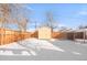 Backyard view with shed and snow on the ground at 185 S Eliot St, Denver, CO 80219