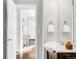 Bathroom with vanity, mirror, and entry to hallway at 185 S Eliot St, Denver, CO 80219