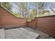 Private back patio with a cement pad, wooden fence, and gravel, perfect for outdoor enjoyment at 8095 Garrison Ct # B, Arvada, CO 80005