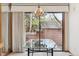 Bright dining area features a modern light fixture and sliding glass doors to an outdoor patio at 8095 Garrison Ct # B, Arvada, CO 80005