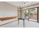 Bright dining room with natural light, stylish chandelier, and sliding glass door at 8095 Garrison Ct # B, Arvada, CO 80005