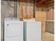Laundry room features a side-by-side washer and dryer and concrete walls and floors at 8095 Garrison Ct # B, Arvada, CO 80005
