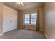 Well-lit bedroom with carpet, window, and double-door closet at 9112 E 29Th Pl, Denver, CO 80238