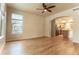 Hardwood floor living room with kitchen and staircase views at 9112 E 29Th Pl, Denver, CO 80238