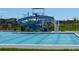 Community pool with water slide and surrounding green space at 9112 E 29Th Pl, Denver, CO 80238