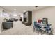 Spacious carpeted basement featuring a cozy fireplace and seating area, perfect for relaxing and entertaining at 7604 Reed St, Arvada, CO 80003