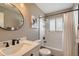 This bathroom features a tub and shower combo and modern fixtures offering a spa-like retreat within your home at 7604 Reed St, Arvada, CO 80003