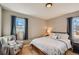 Relaxing bedroom with a comfortable bed, soft lighting, and window views, creating a serene retreat at 7604 Reed St, Arvada, CO 80003