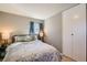 Inviting bedroom with closet, soft lighting, and cozy bed at 7604 Reed St, Arvada, CO 80003